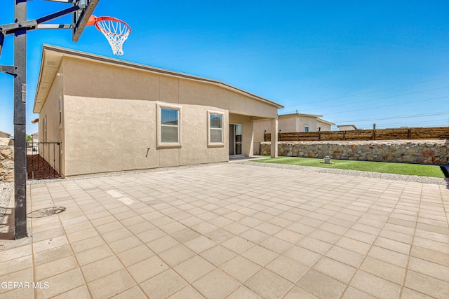 14940 Tierra Escape Ave, El Paso, TX 79938 - back of house featuring fence, a patio area, and stucco siding