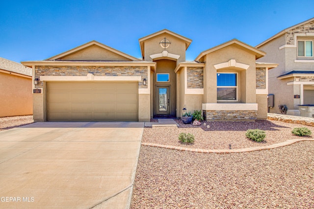 view of front of home with an attached garage, stucco siding, stone siding, and concrete driveway