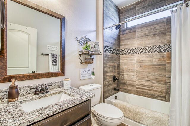 bathroom featuring vanity, toilet, and shower / bath combo with shower curtain