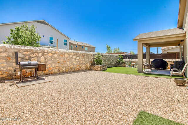 view of yard featuring a fenced backyard and a patio