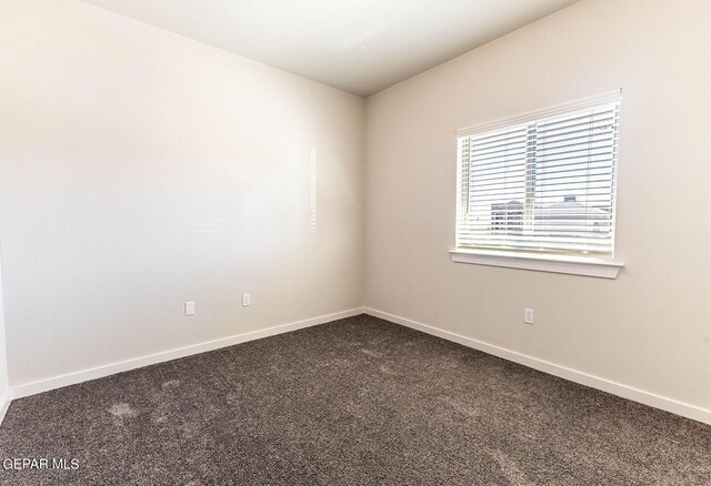 3817 Course St, El Paso, TX 79938 - unfurnished room with dark colored carpet and baseboards