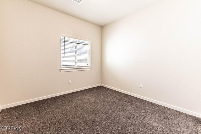 3817 Course St, El Paso, TX 79938 - spare room featuring baseboards, visible vents, and dark colored carpet