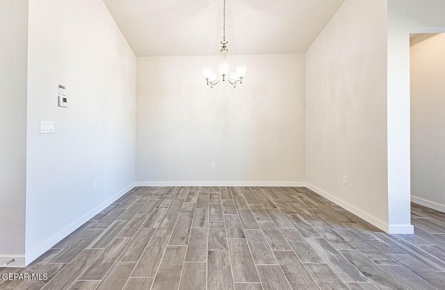 3817 Course St, El Paso, TX 79938 - empty room featuring an inviting chandelier, baseboards, and wood finished floors
