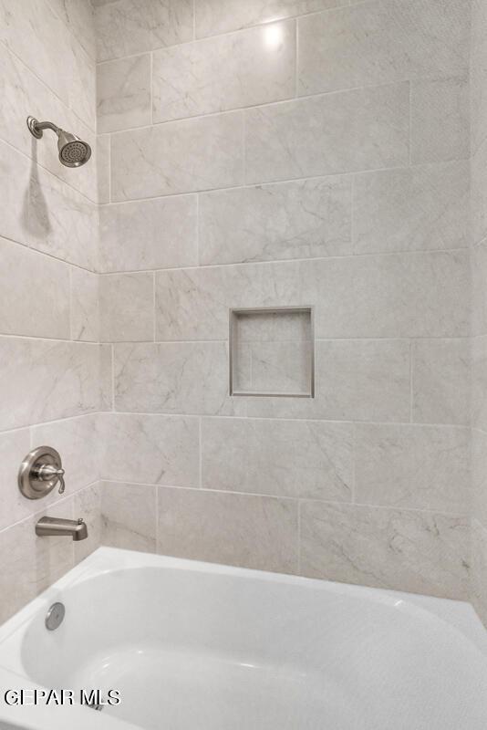 bathroom featuring bathing tub / shower combination