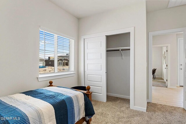 bedroom featuring baseboards, carpet, a closet, and visible vents
