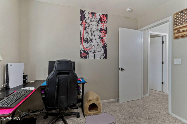 carpeted home office with baseboards