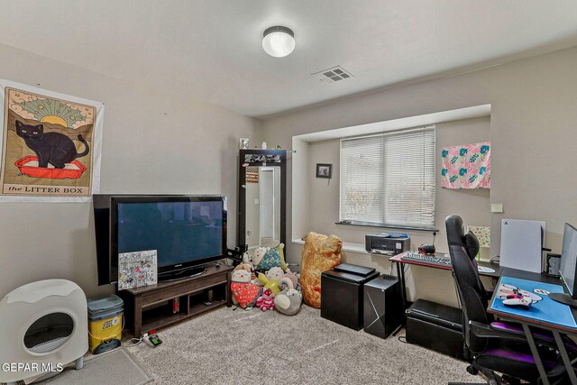 carpeted office space featuring visible vents