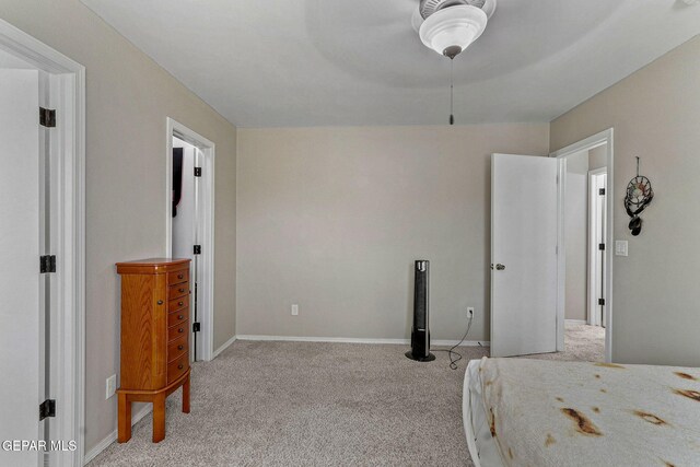 bedroom with baseboards, ceiling fan, and carpet flooring