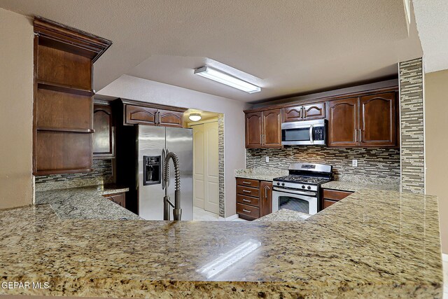 kitchen featuring open shelves, dark brown cabinetry, tasteful backsplash, light stone counters, and appliances with stainless steel finishes