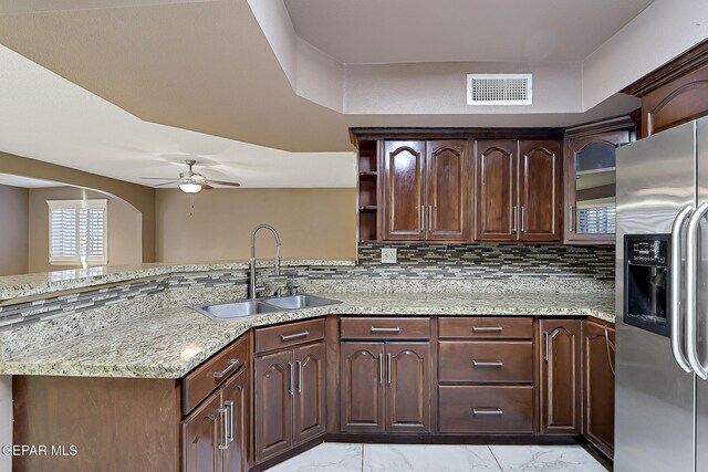 kitchen featuring ceiling fan, visible vents, a sink, marble finish floor, and stainless steel fridge