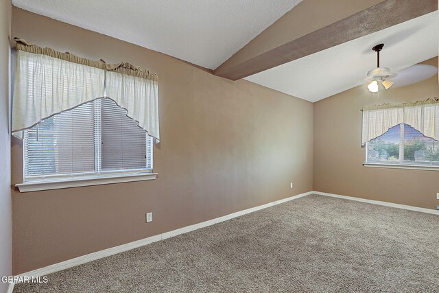 spare room with carpet flooring, a ceiling fan, and lofted ceiling