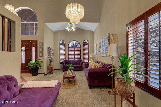 12541 Setting Sun Dr, El Paso, TX 79938 - living area featuring an inviting chandelier, carpet flooring, and a towering ceiling