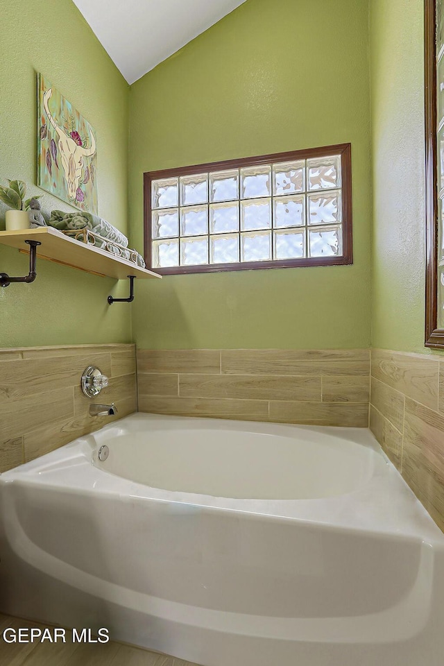 12541 Setting Sun Dr, El Paso, TX 79938 - full bath with a textured wall and a bath