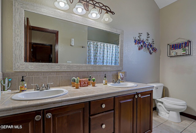 12541 Setting Sun Dr, El Paso, TX 79938 - bathroom featuring double vanity, toilet, a sink, and tile patterned flooring