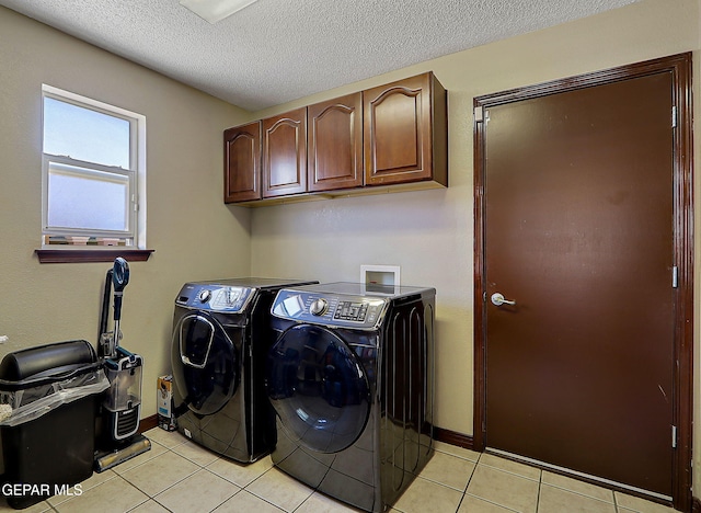 12541 Setting Sun Dr, El Paso, TX 79938 - laundry area with cabinet space, light tile patterned flooring, a textured ceiling, baseboards, and washing machine and dryer