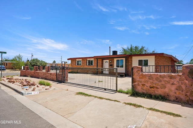 5540 Norwood Ct, El Paso, TX 79924 - ranch-style house with brick siding, a fenced front yard, and a gate