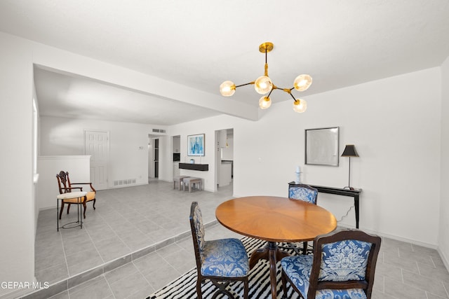 5540 Norwood Ct, El Paso, TX 79924 - dining area featuring a chandelier, light tile patterned floors, and baseboards