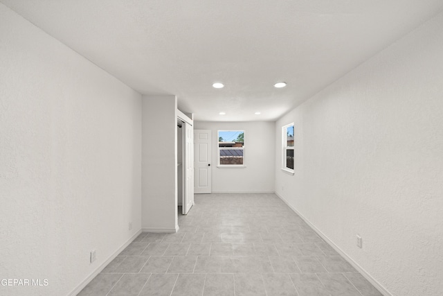 5540 Norwood Ct, El Paso, TX 79924 - corridor featuring recessed lighting, a barn door, and baseboards