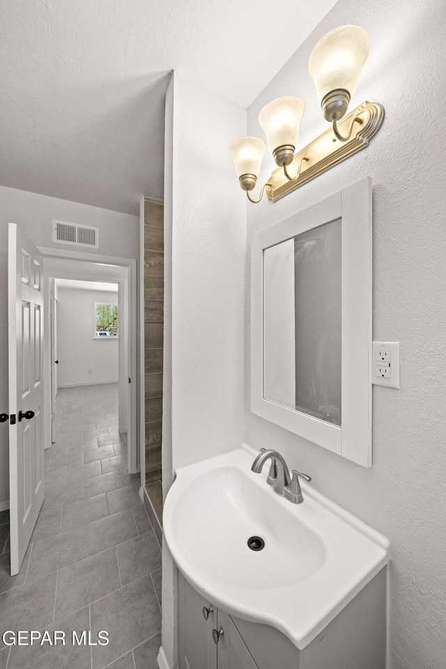 5540 Norwood Ct, El Paso, TX 79924 - bathroom featuring tile patterned floors and vanity
