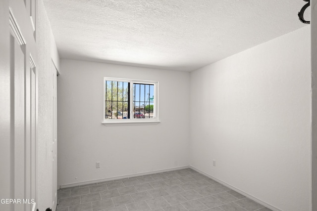 5540 Norwood Ct, El Paso, TX 79924 - empty room featuring a textured ceiling