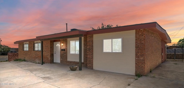 5540 Norwood Ct, El Paso, TX 79924 - back of house with brick siding, fence, and a patio area