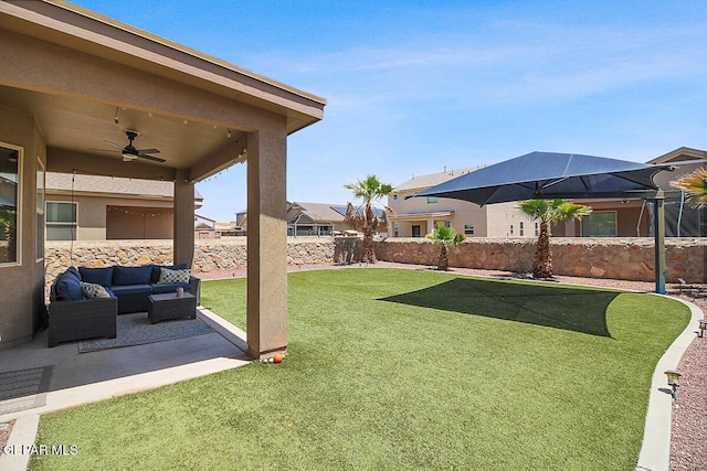 view of yard with a ceiling fan, a residential view, a patio area, a fenced backyard, and an outdoor hangout area