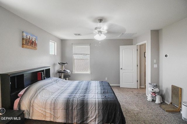 carpeted bedroom with baseboards, ceiling fan, and visible vents