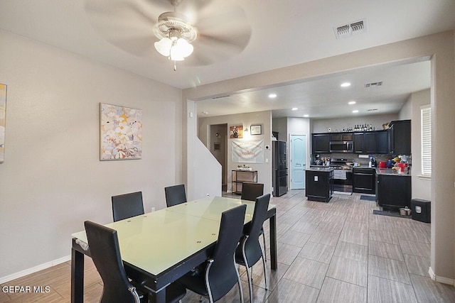 dining area with baseboards, a ceiling fan, recessed lighting, and visible vents