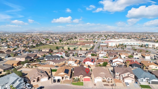 birds eye view of property with a mountain view and a residential view
