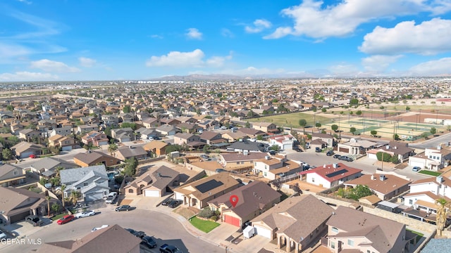 drone / aerial view featuring a residential view and a mountain view