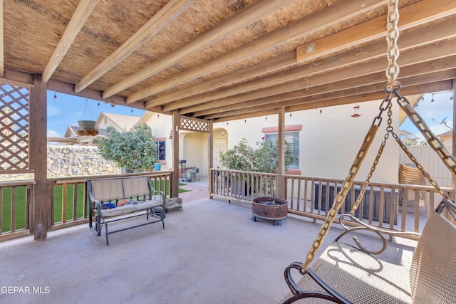 view of patio featuring an outdoor fire pit