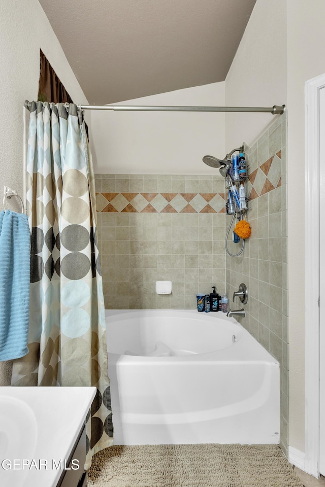 bathroom featuring vanity and shower / tub combo