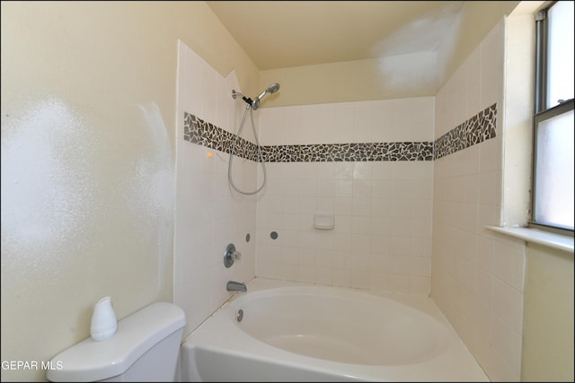 bathroom featuring toilet and shower / bathing tub combination