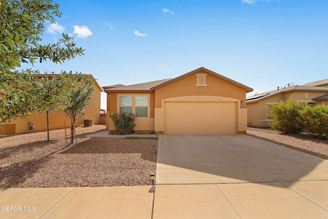 1021 Aerodyne Pl, El Paso, TX 79928 - view of front facade featuring stucco siding, a garage, and concrete driveway