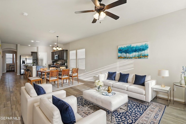 1021 Aerodyne Pl, El Paso, TX 79928 - living area with a ceiling fan, baseboards, light wood-style flooring, a chandelier, and recessed lighting
