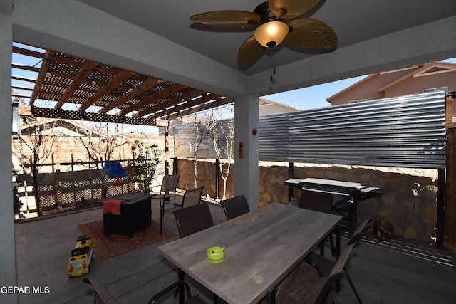view of patio with a fenced backyard, outdoor dining space, ceiling fan, and a pergola