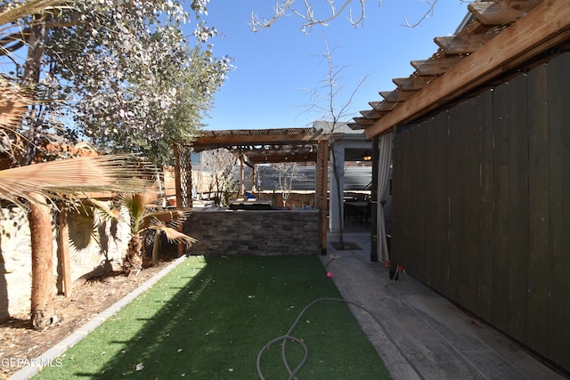 view of yard featuring a pergola and a fenced backyard