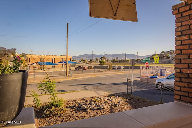 exterior space featuring fence and a mountain view
