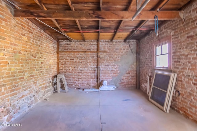 below grade area featuring brick wall