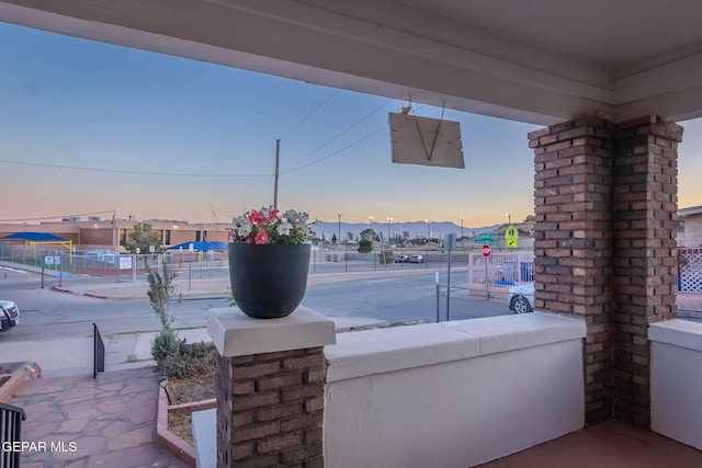 view of patio terrace at dusk