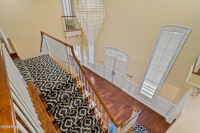 624 Mount Cristo Rey Ln, El Paso, TX 79922 - staircase with wood finished floors, wainscoting, and a decorative wall