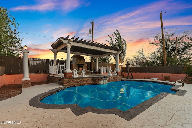 624 Mount Cristo Rey Ln, El Paso, TX 79922 - view of pool with an outdoor stone fireplace, a fenced backyard, and a patio area