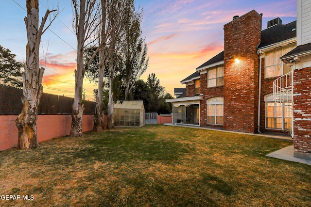 624 Mount Cristo Rey Ln, El Paso, TX 79922 - yard at dusk featuring an exterior structure and an outdoor structure