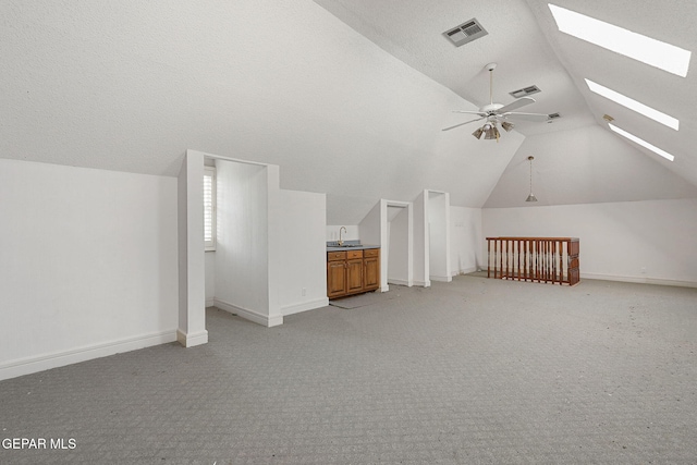 624 Mount Cristo Rey Ln, El Paso, TX 79922 - bonus room with vaulted ceiling, a skylight, light carpet, a ceiling fan, and a sink