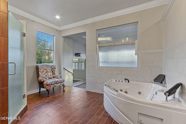 624 Mount Cristo Rey Ln, El Paso, TX 79922 - full bathroom with wood finished floors, crown molding, a whirlpool tub, tile walls, and baseboards