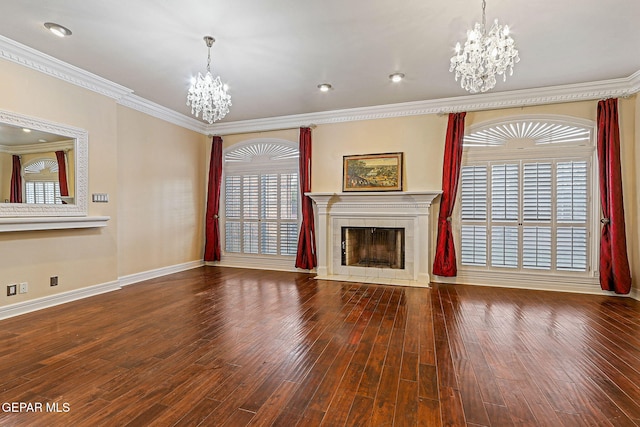 624 Mount Cristo Rey Ln, El Paso, TX 79922 - unfurnished living room featuring a chandelier, a tile fireplace, baseboards, crown molding, and healthy amount of natural light