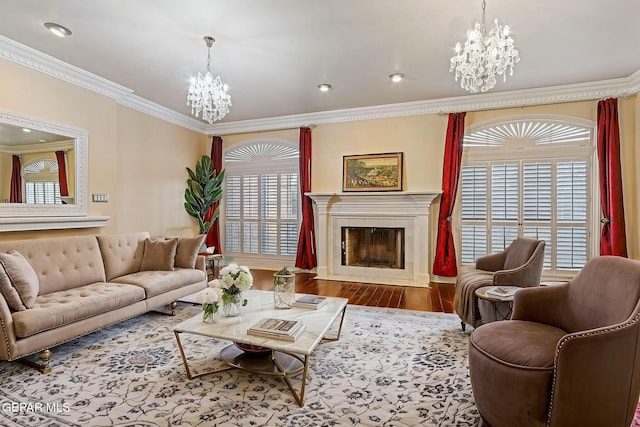 624 Mount Cristo Rey Ln, El Paso, TX 79922 - living area featuring a chandelier, a fireplace, ornamental molding, wood finished floors, and recessed lighting