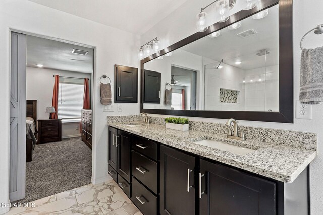 full bathroom featuring a sink, a ceiling fan, ensuite bath, and visible vents