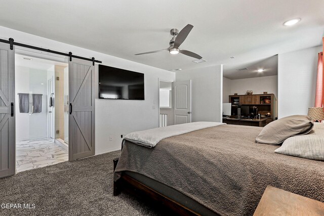 bedroom with visible vents, marble finish floor, baseboards, a barn door, and a ceiling fan