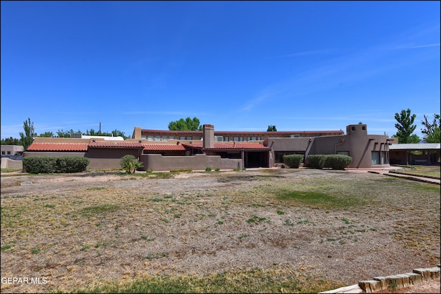 5401 Tierra Vista Dr, El Paso, TX 79932 - view of front of house with stucco siding and a tiled roof